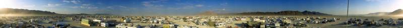 Panorama: Sunset at Burning Man 2001, from a tower camp near the entrance from the hiway.