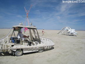 This whale skeleton sat on the edge of playa, and reminded people of my art car, so here they are together, with me at the wheel.