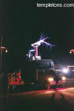 The Tesla coil was truck mounted, and would drive around camp doing a show.  This time, a man in a metal suit let most of the sparks fly off him.
