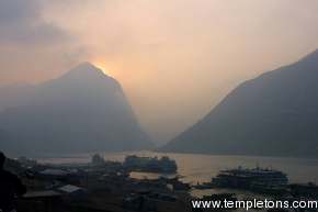 The sun rises behind the mountains as we head to the lesser 3 gorges