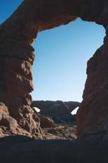 The North and South Windows, viewed through Turret Arch at sunrise, look like a monster's eyes.
