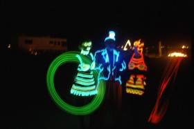 Three of the nicest el-wire suits from the Black Rock Electrical Parade