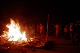 Sunday night, people gather around a burn, and while most are freezing, some are dedicated enough to get warm and naked by the fire, dancing to drums
