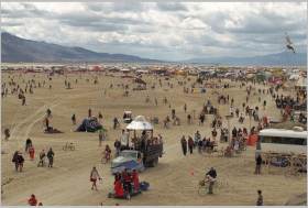 Wide view of Head Way leading up to our camp during a busy time of day.  Thunderdome is empty but the playa is full of people.