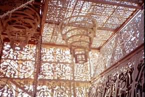 Inside the glorious mausoleum, light filters through the jigsaw panels.