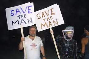 K. and I, after the burn, still paraded with the Save the Man signs.  See full story above.