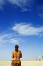 Woman flies kites on the playa
