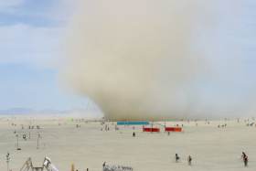 A giant dust devil moves over the city