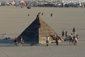 Many climb the pyramid at sunset