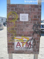 The ATM's brick wall after it was tagged by vandals.  