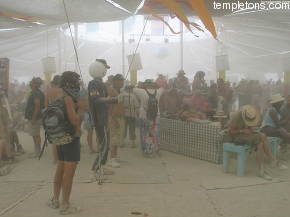 The Saturday dust storm is thick, even inside the cafe