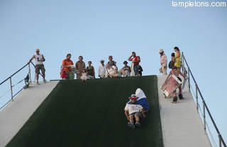 I prepare to go down the slide.  It caused more injuries (rugburn) than anything else ever did at Burning Man.