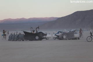 These two serpents, one with muticolour LEDs chased one another around the Playa all night