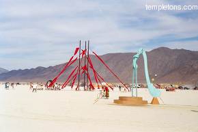 Two adjacent art installations in the desert