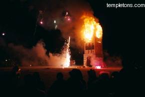 The clock tower burns at midnight, ending the procession around the hours of the clock.
