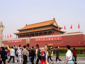 Tourist crowds by the south gate.  The picture of Mao is renewed each year