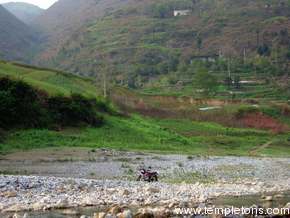 Motorcycle waits on bank in lesser 3 gorges