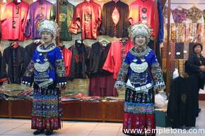 Young girls show of recreated costumes of the Miao people