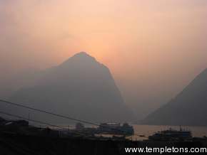 Sunrise behind the mountains at entrance to little 3 gorges