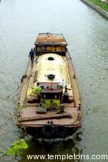 Barge moves down the canal