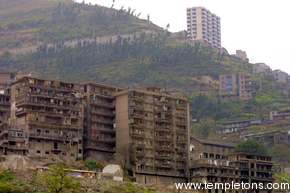 Contrast between older apartments, to be demolished, and new housing projects higher on the hill.
