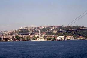 The bridge over the Bosphorus along with oceanside palaces and mosques.