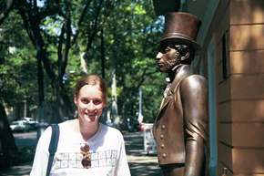 K. with Pushkin's statue, outside his museum.