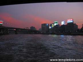 Sun sets on the river and the double decker bridges