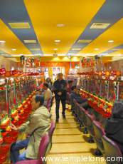 A (fairly empty) Pachinko parlour.  Pachinko is now supposedly one of the top recreations in Japan.  It's a pinball-related gambling game with little skill.  Gambling is illegal, so you win prizes that you can then go next door to redeem for money.  There were Pachinko parlours everywhere