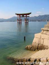 Nice view, shot by K, of the Torii at the entrance to Itsukushima shrine.  The Torii is submerged at high tide.  At low tide you can take these steps and walk out to it.