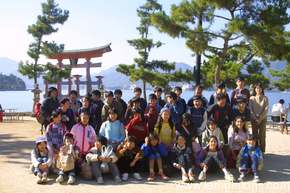 And the standard bunch of kids, these obviously more middle-school, posing by the Torii for their group photo, but happy to wave at the crazy westerner.