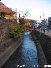 In Takayama, all the streets have open storm sewers (probably once the sanitary sewers) along the sides.  At all times, the stream that comes into town is diverted through all of them, and then it flows back into its regular bed here.