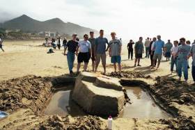 This crew, in the sandcastle contest, built a sinking ship, then soaked it with lighter fluid to set it on fire.
