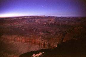 The Grand Canyon lit by moonlight, a 30 second exposure.   You can see the stars above the horizon.
